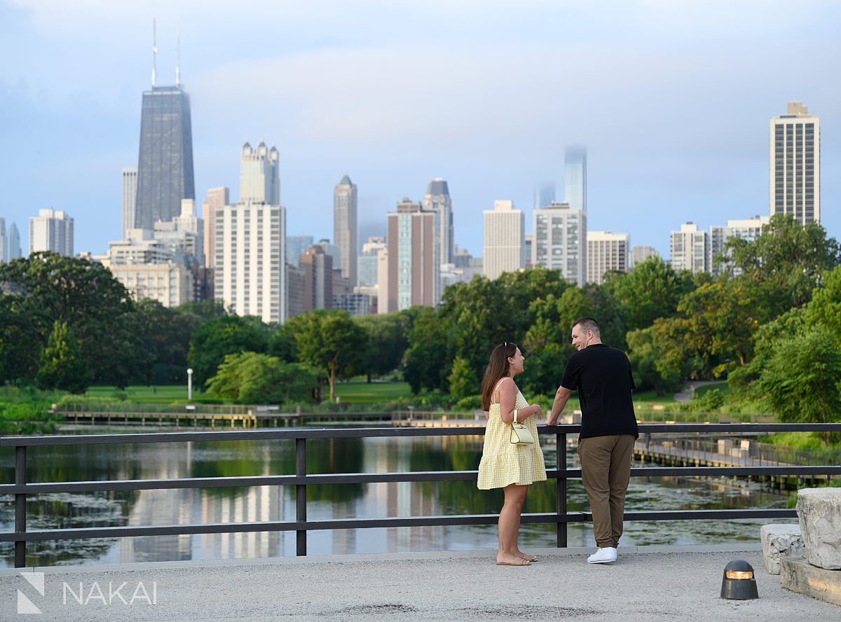 candid moment on bridge over south pond after lincoln park proposal
