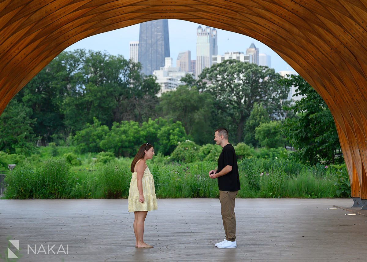 stunned look during peoples gas pavilion proposal just looking at each other