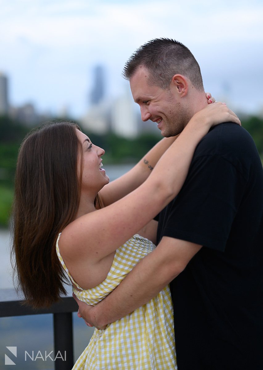couple on bridge looking at each other south pond engagement