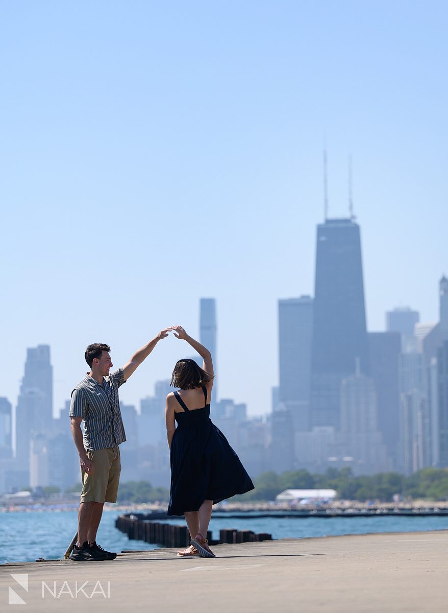 dancing twirl chicago lake Michigan engagement photos