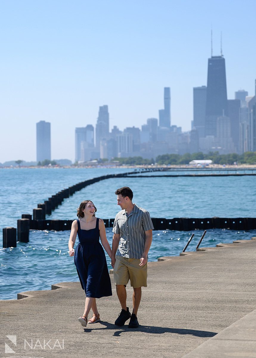 chicago lake Michigan engagement photos walking holding hands