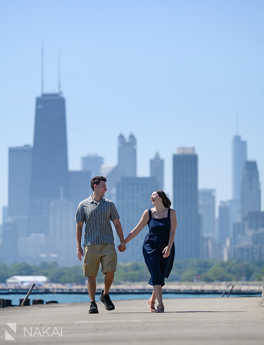 chicago lakefront engagement photos walking holding hands