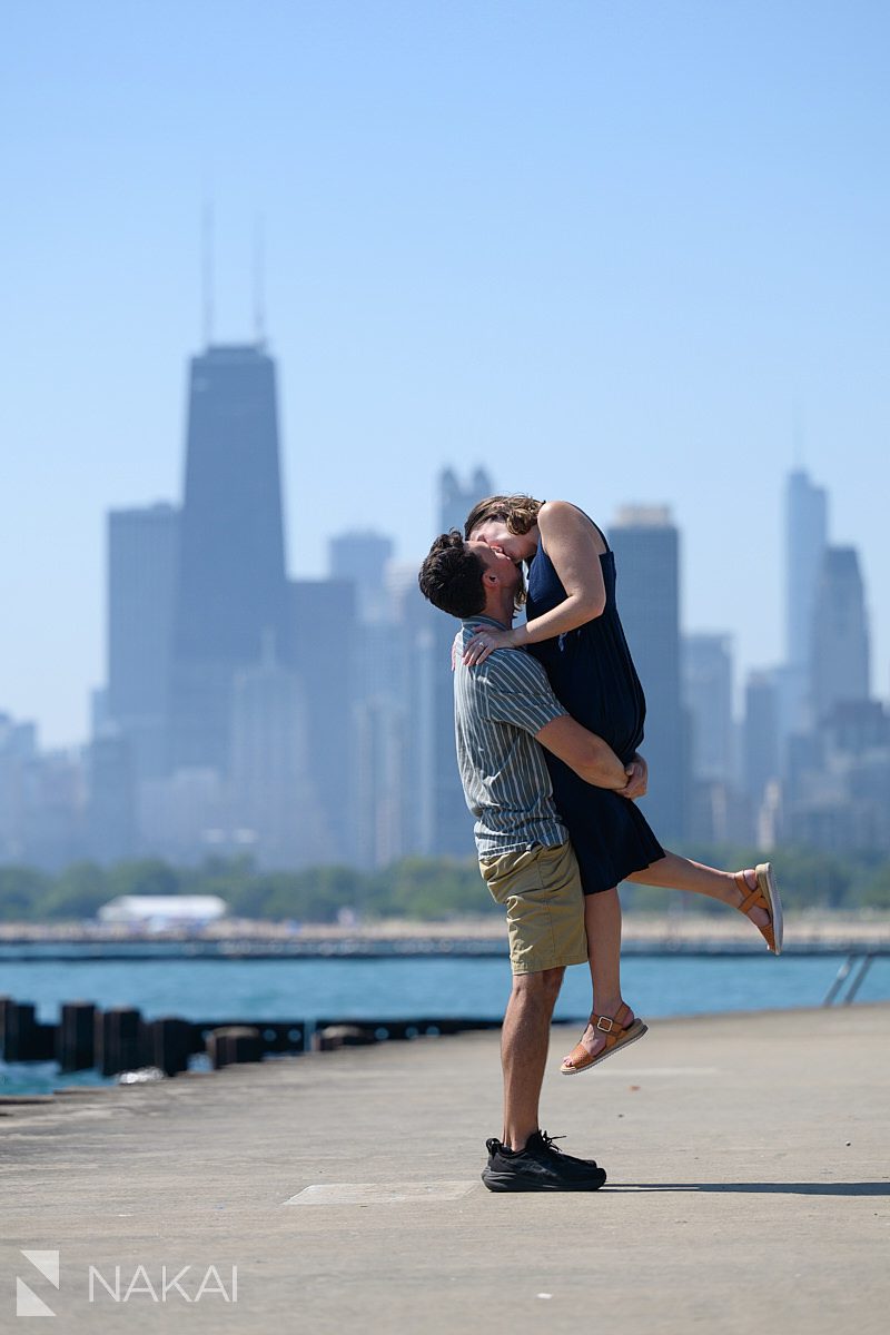 chicago lakefront engagement photos lift and kiss