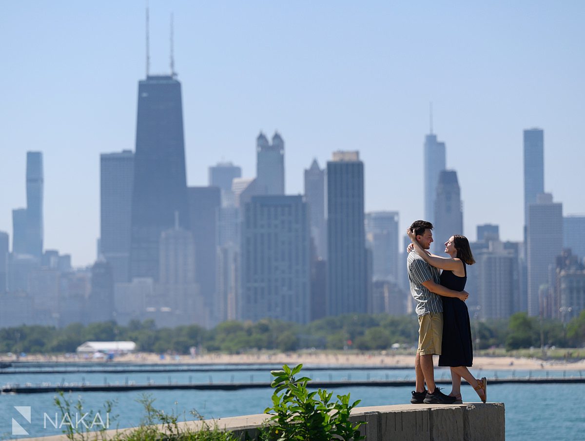 skyline in background chicago lakefront engagement photos