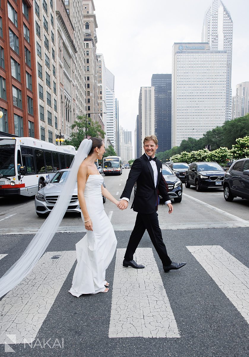 bride groom walking across michigan avenue