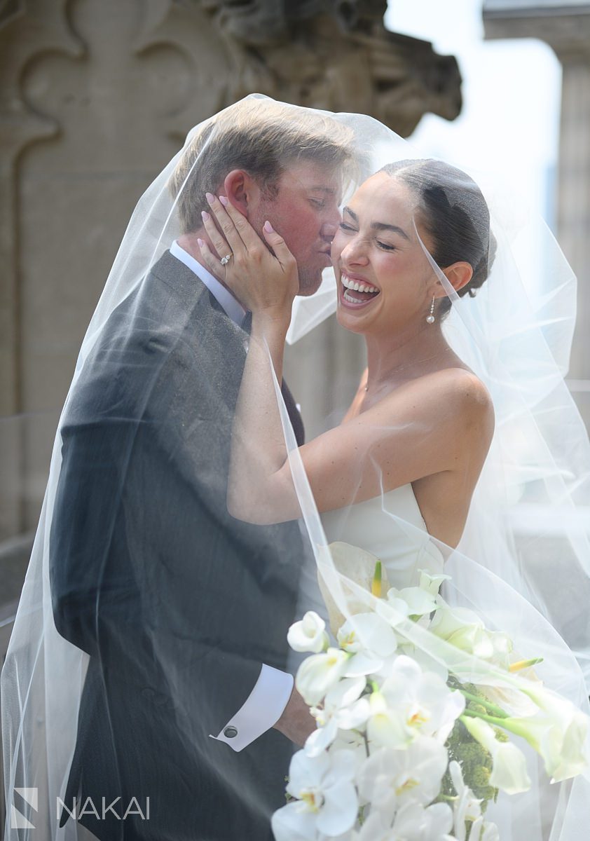 kiss on cheek university club chicago wedding photo