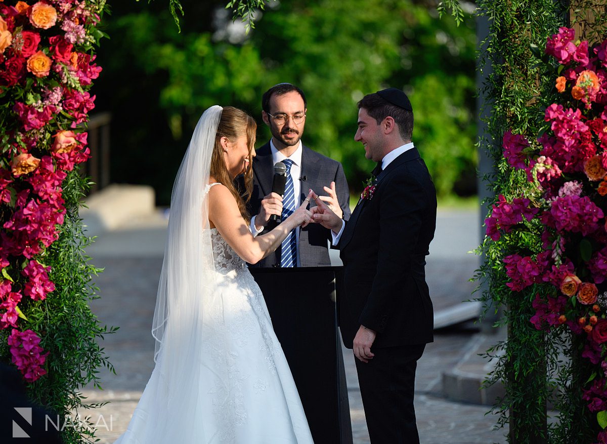 ceremony rockwell on the river wedding putting ring on