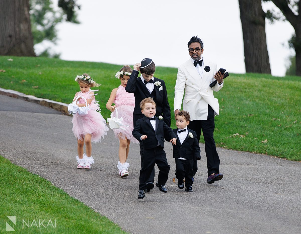 events by shaun rajah leading ring bearers to ceremony