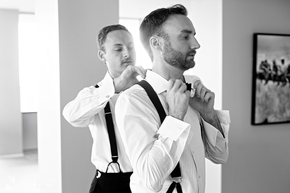 groom getting ready with brother