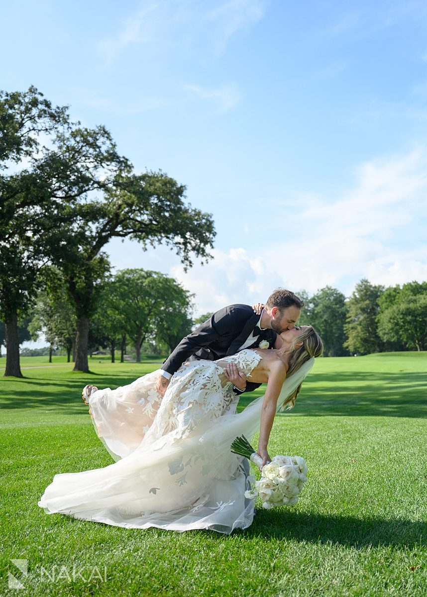 twin orchard country club wedding photo bride groom dip and kiss