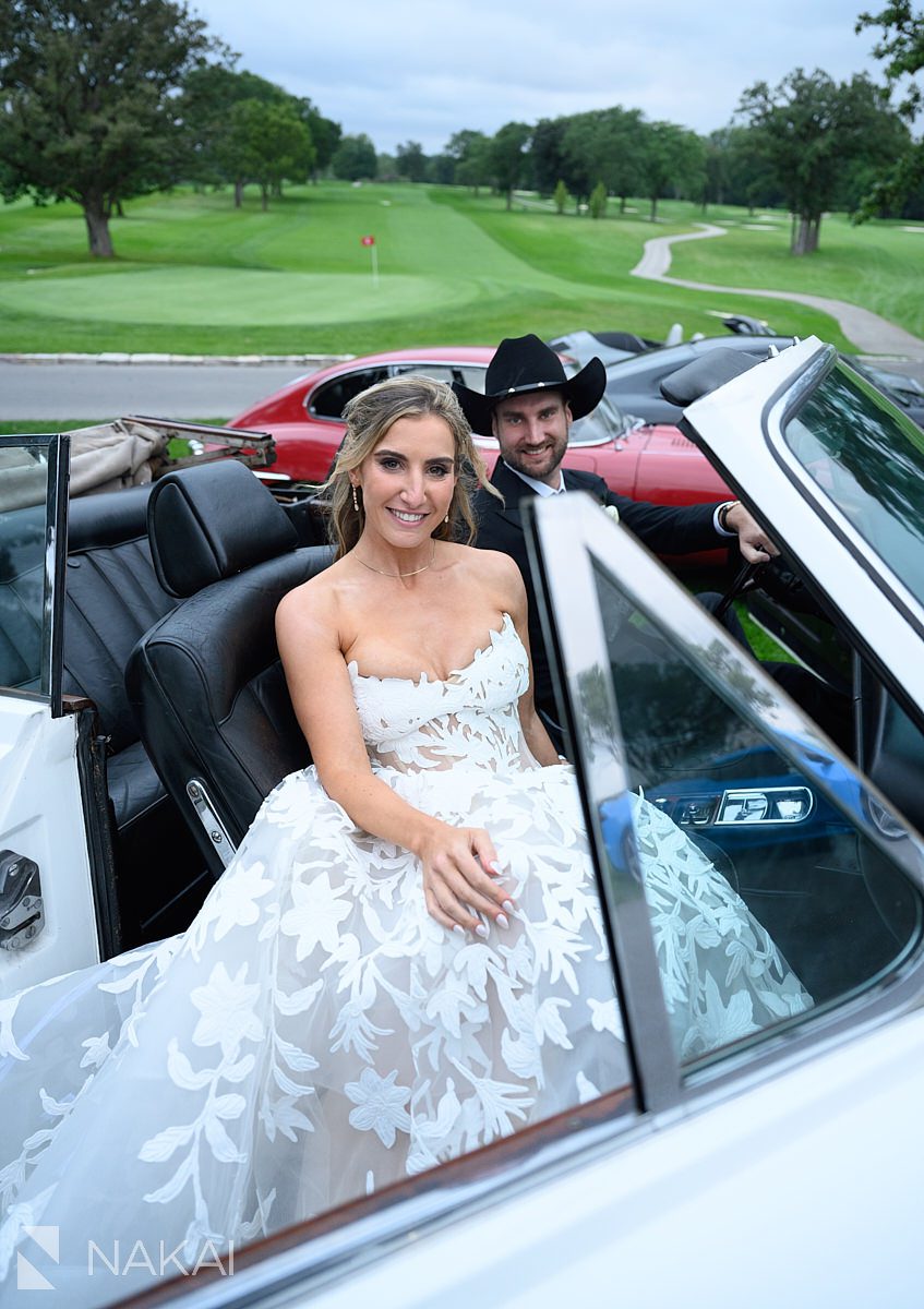 wedding day vintage cars bride and groom smiling