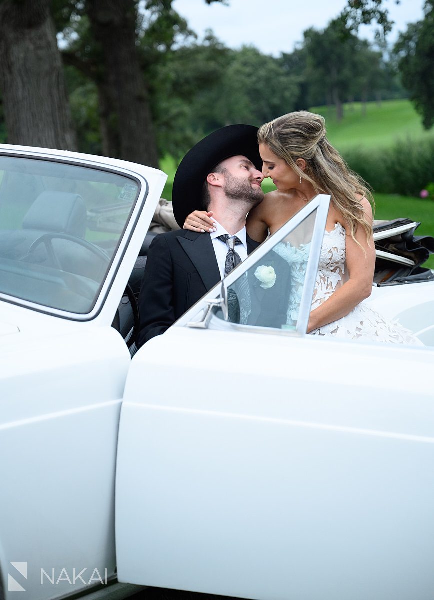 wedding day vintage cars bride and groom kiss