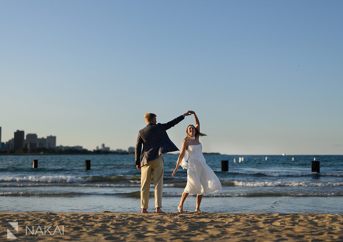 north ave beach sand engagement photos couple dancing at sunset