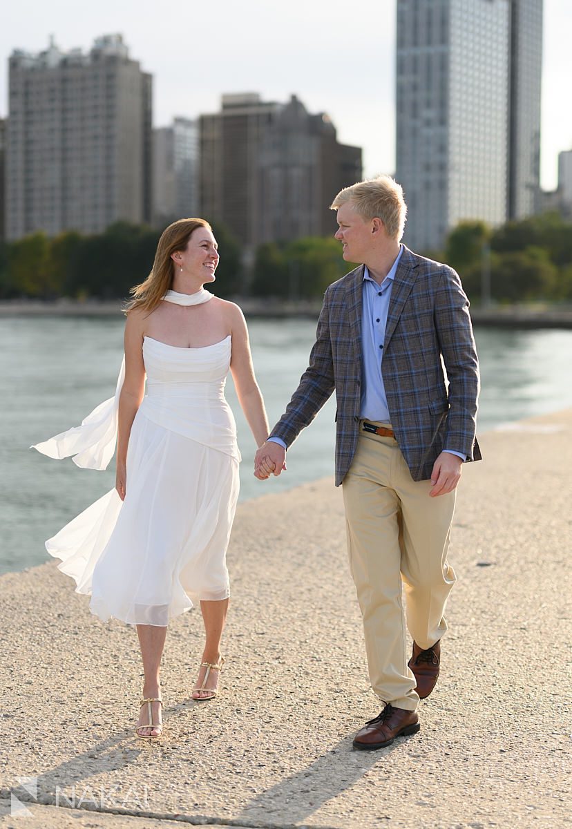 north avenue pier engagement photos walking holding hands