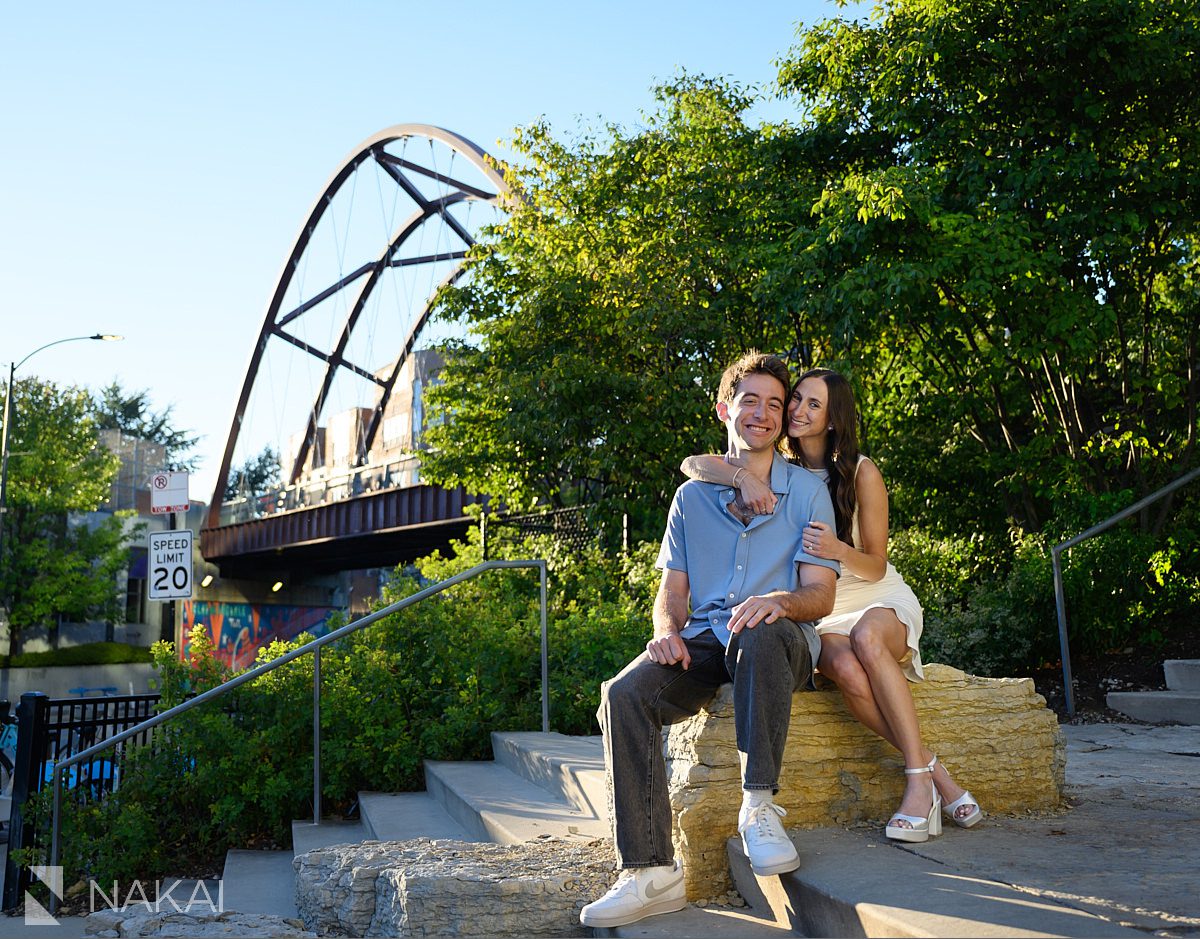 606 Bloomingdale Trail engagement photos couple smiling with bridge in background