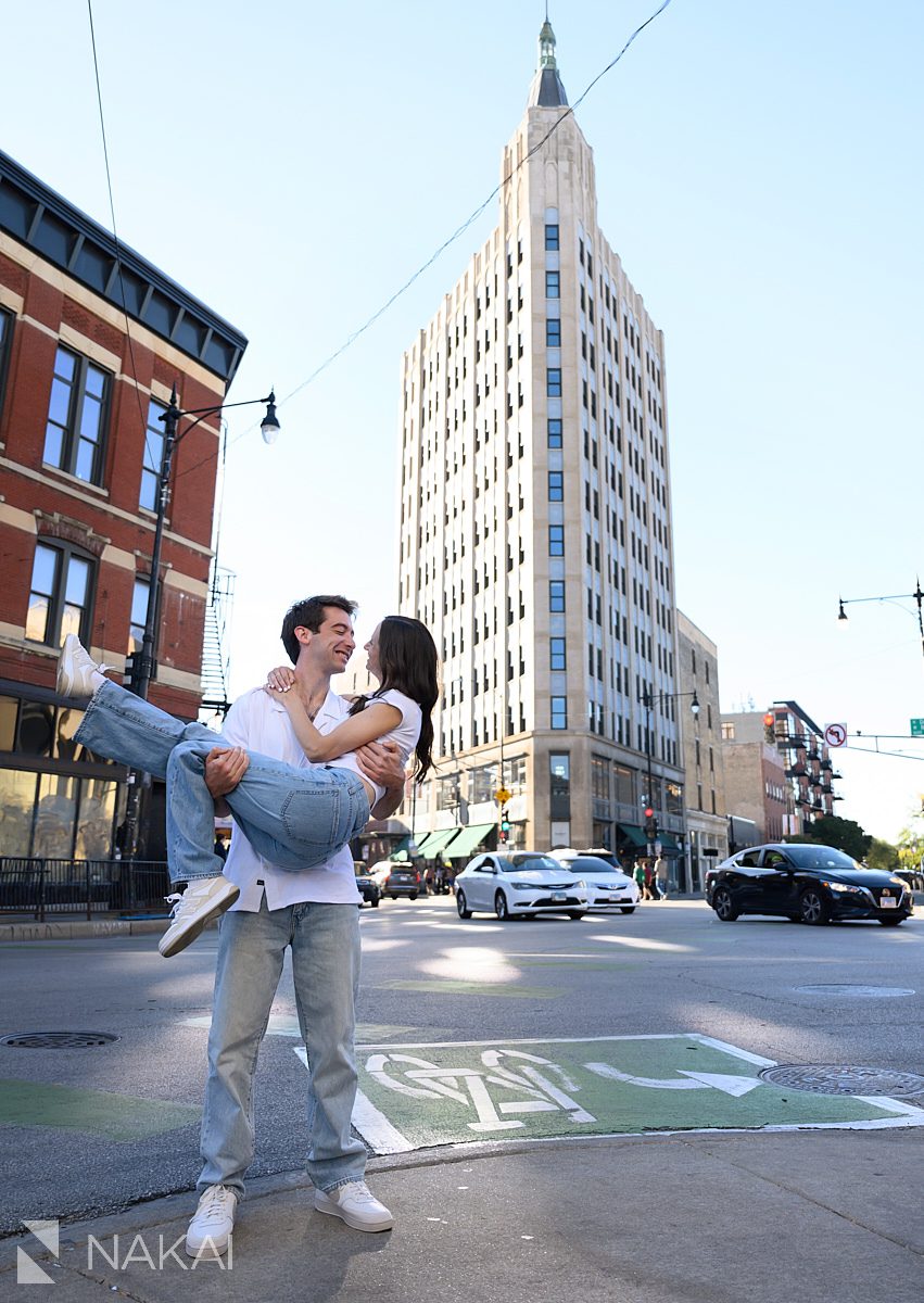 wicker park engagement photos guy carrying girl by Robey Hotel